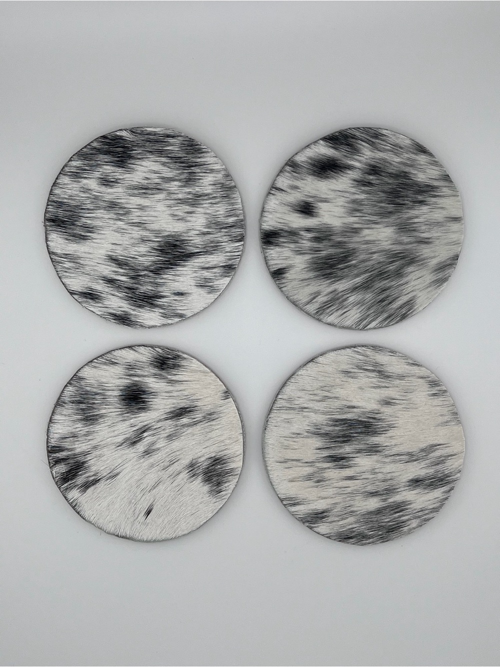Set of 4 Round Black & White Cowhide Coasters